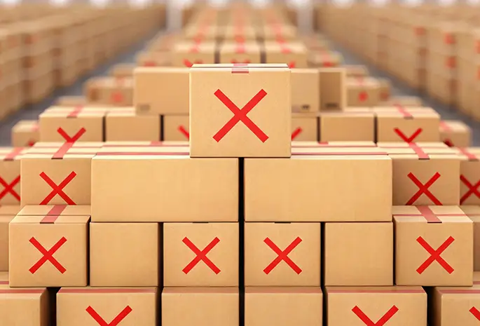 Stacked boxes with red 'X' markings indicating restricted or prohibited items - central il