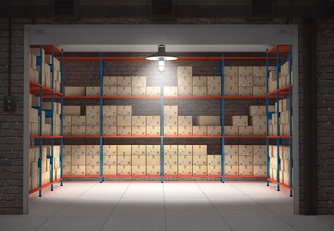 Self storage unit full of cardboard boxes